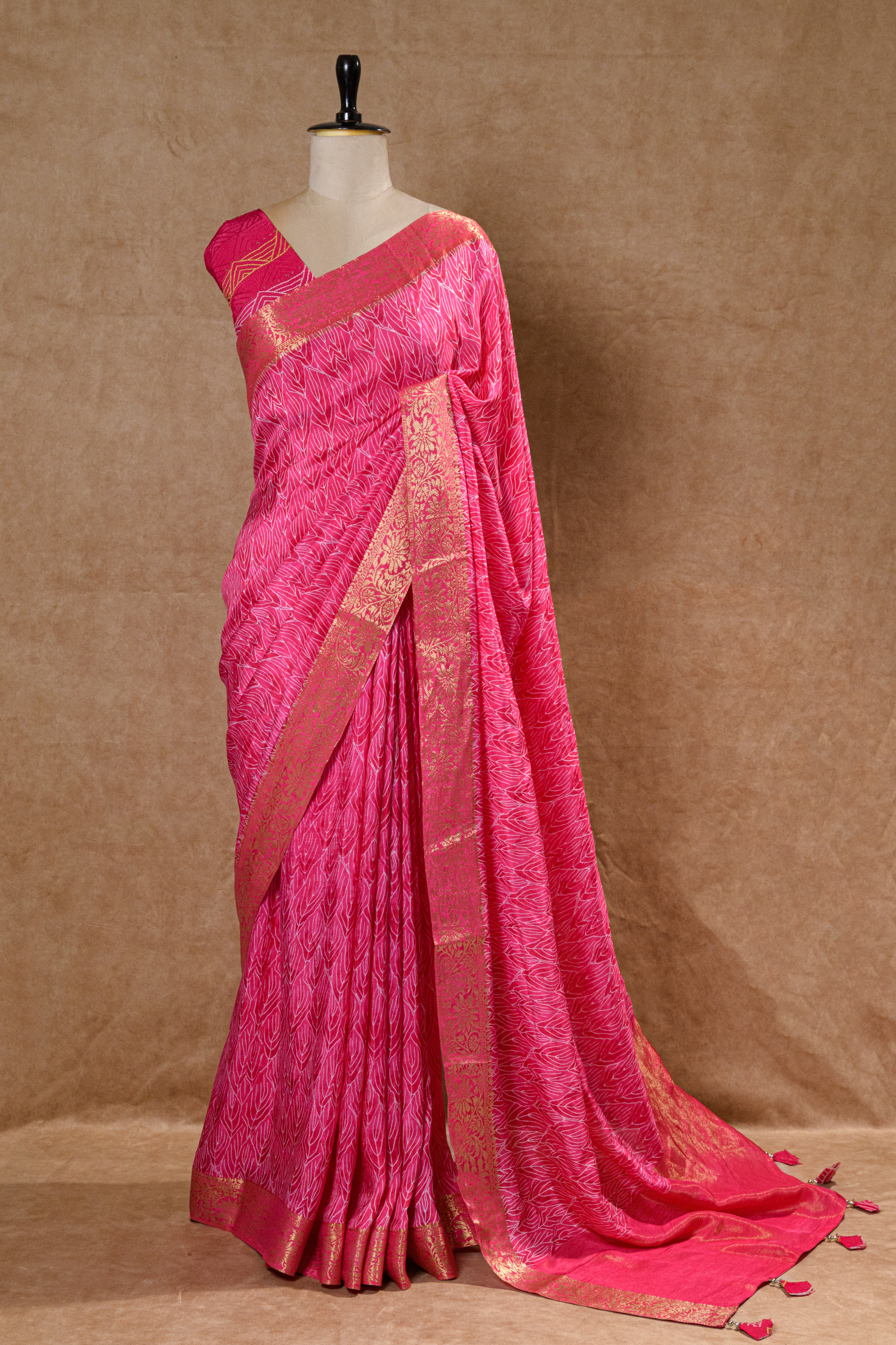 Rani Pink Crepe Silk Saree with Golden Zari Border and Embroidered Blouse