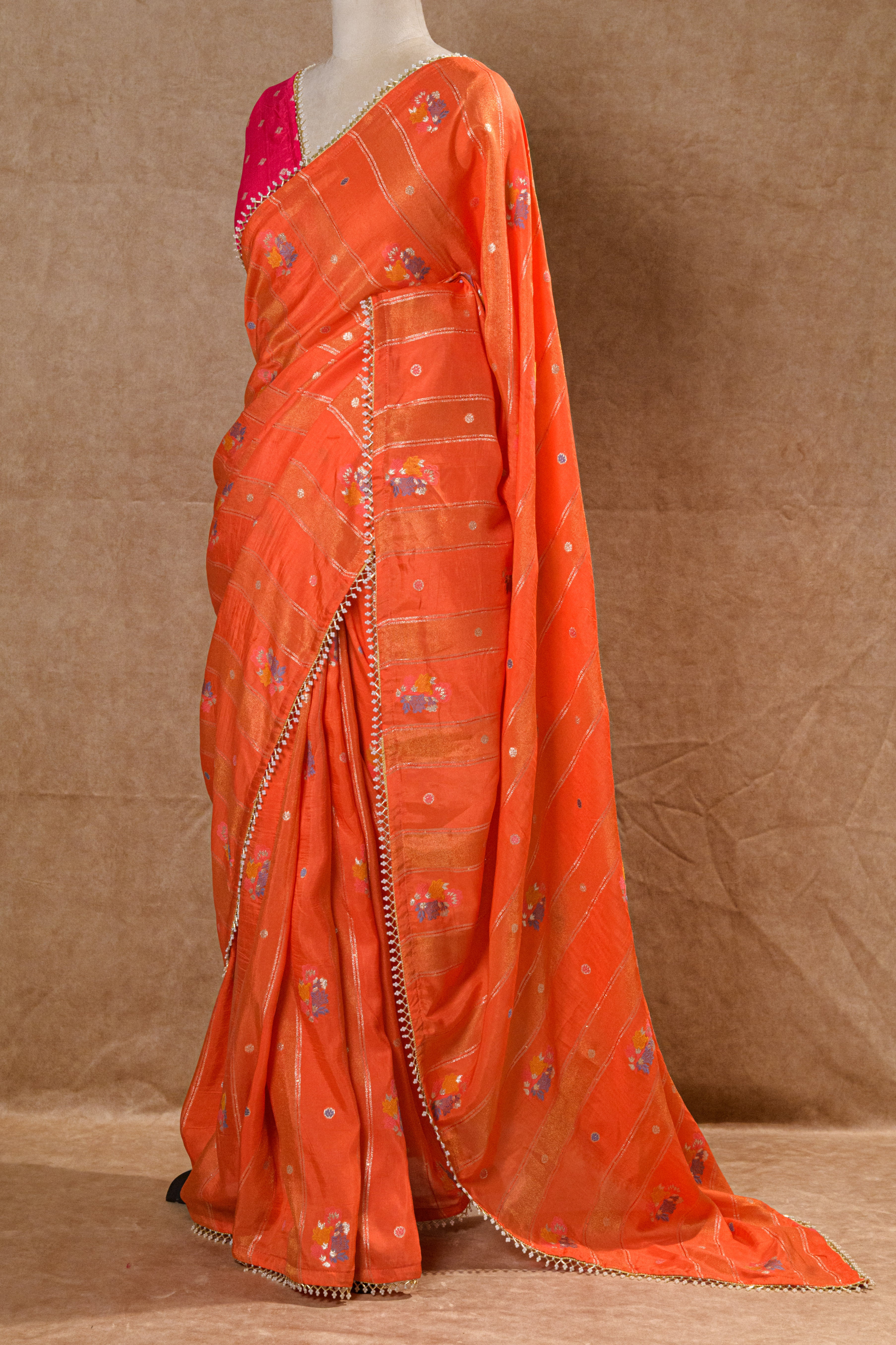 Orange Organza Saree with Rani Pink Handworked Blouse and Kundan Moti Detailing