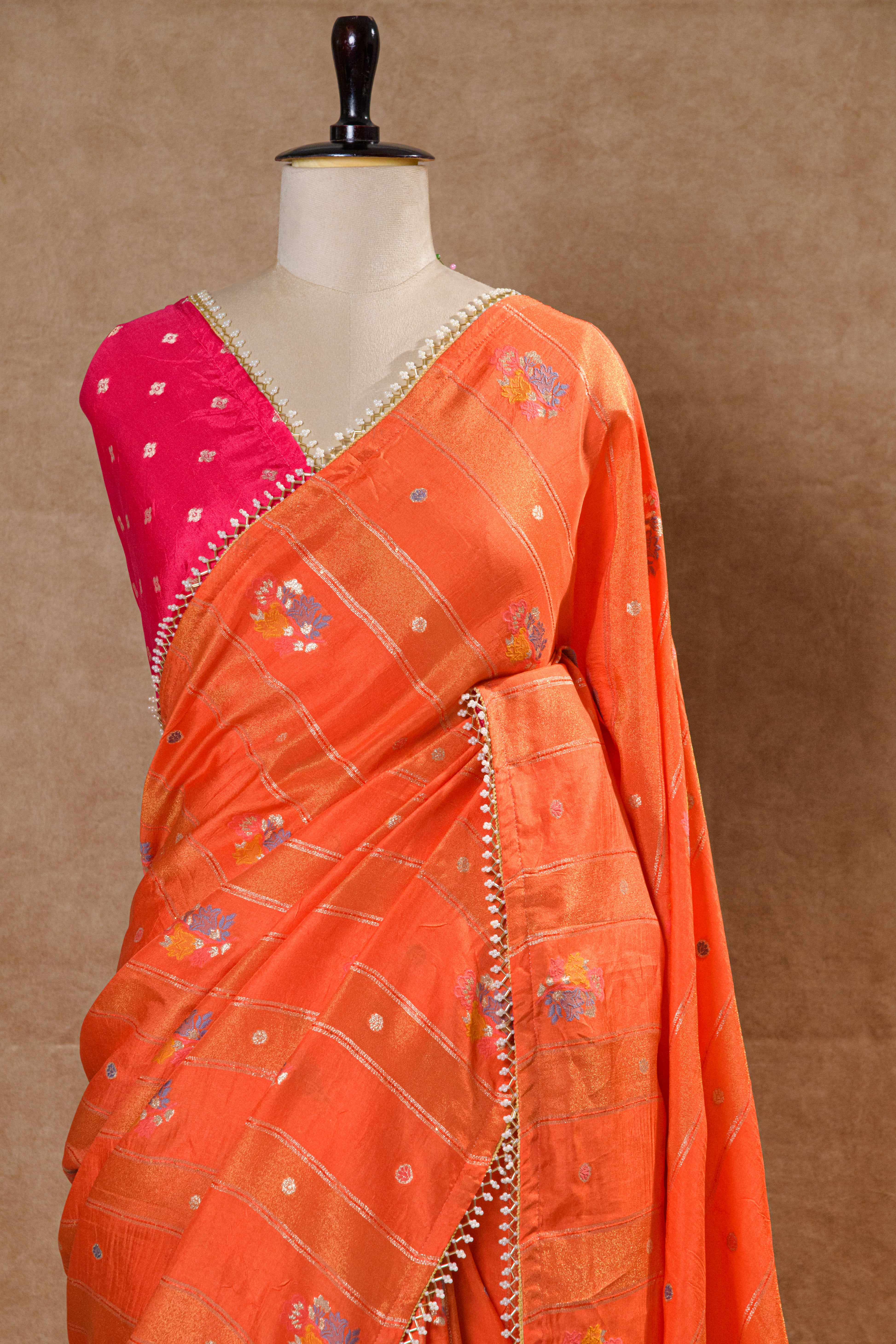 Orange Organza Saree with Rani Pink Handworked Blouse and Kundan Moti Detailing