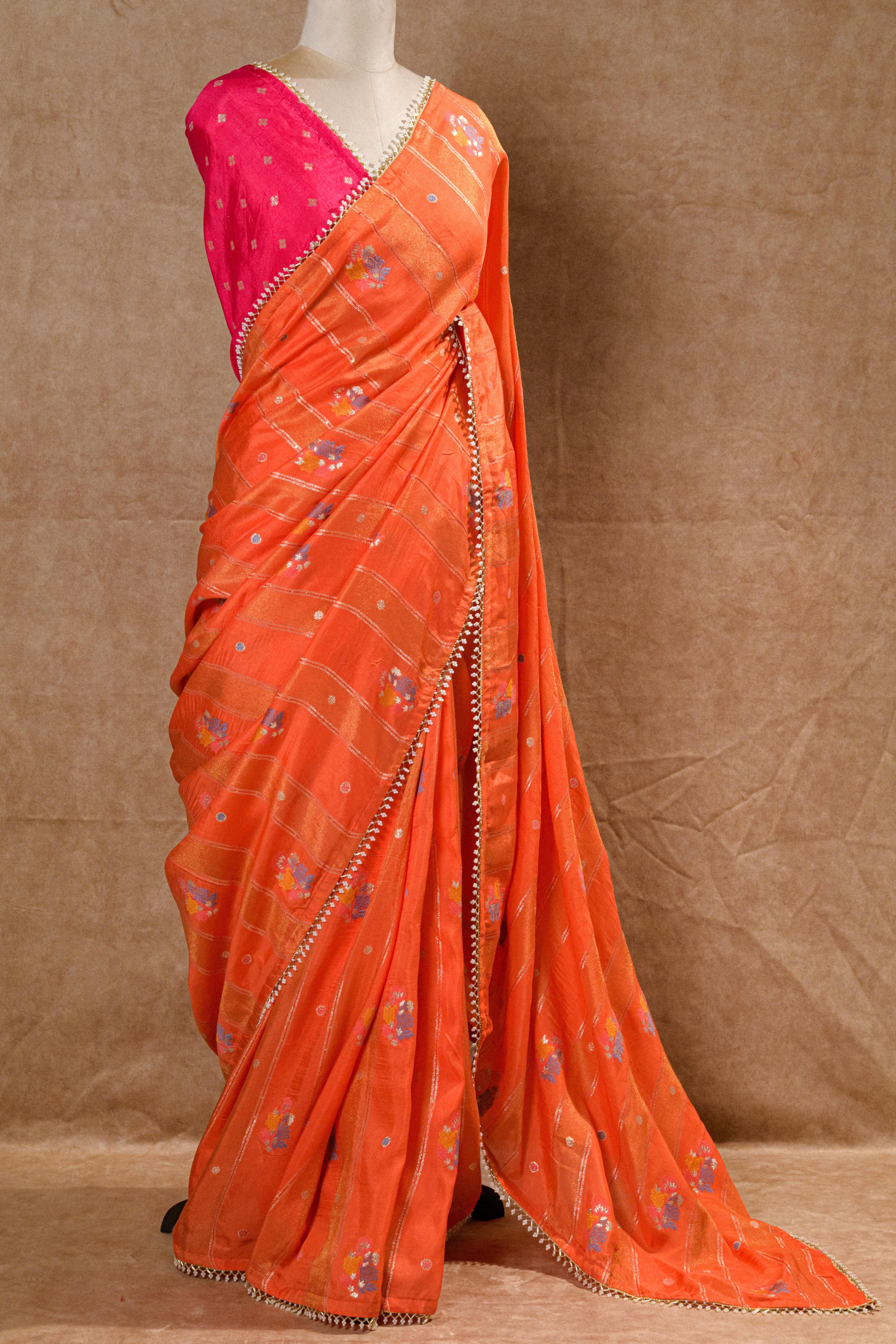Orange Organza Saree with Rani Pink Handworked Blouse and Kundan Moti Detailing