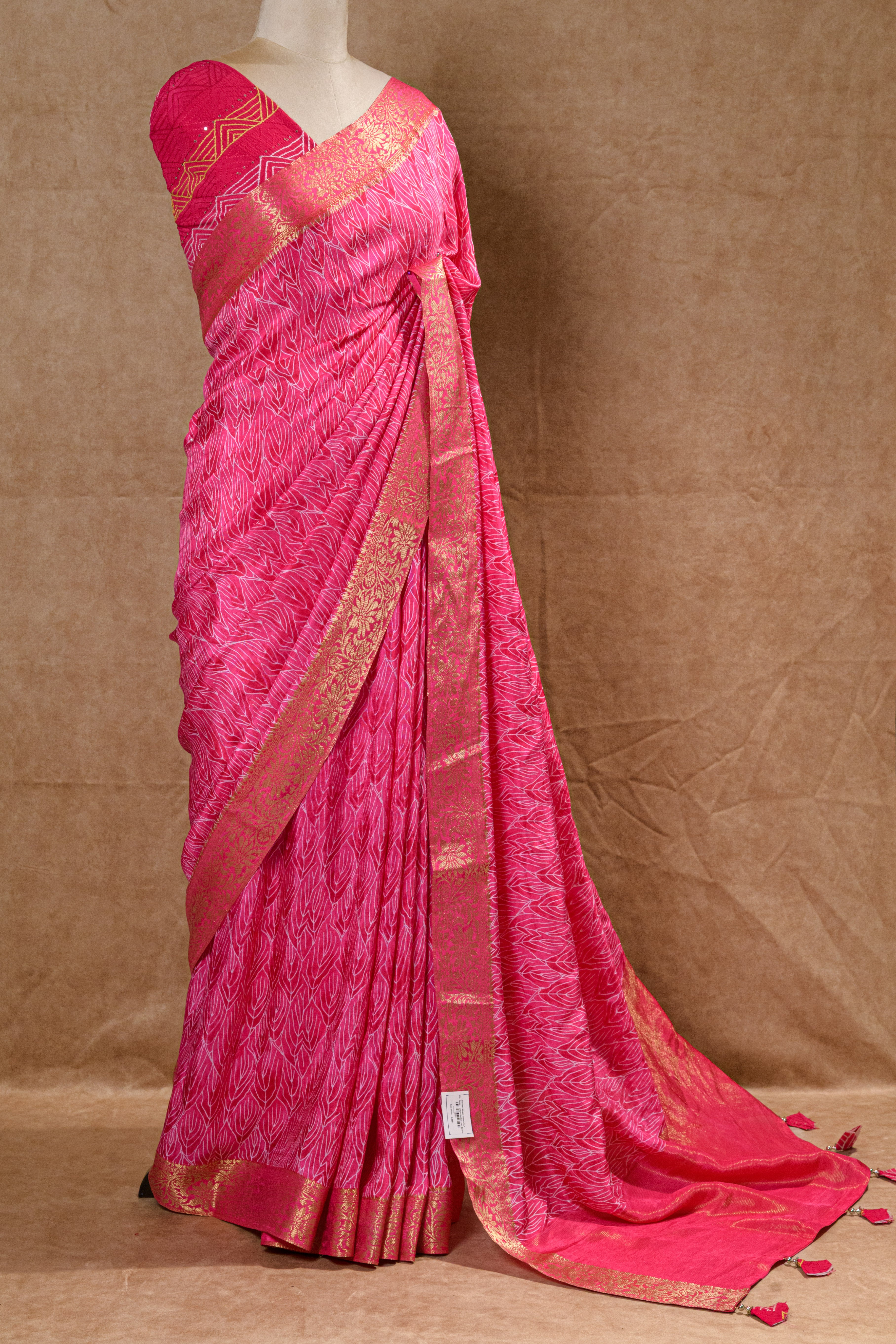 Rani Pink Crepe Silk Saree with Golden Zari Border and Embroidered Blouse