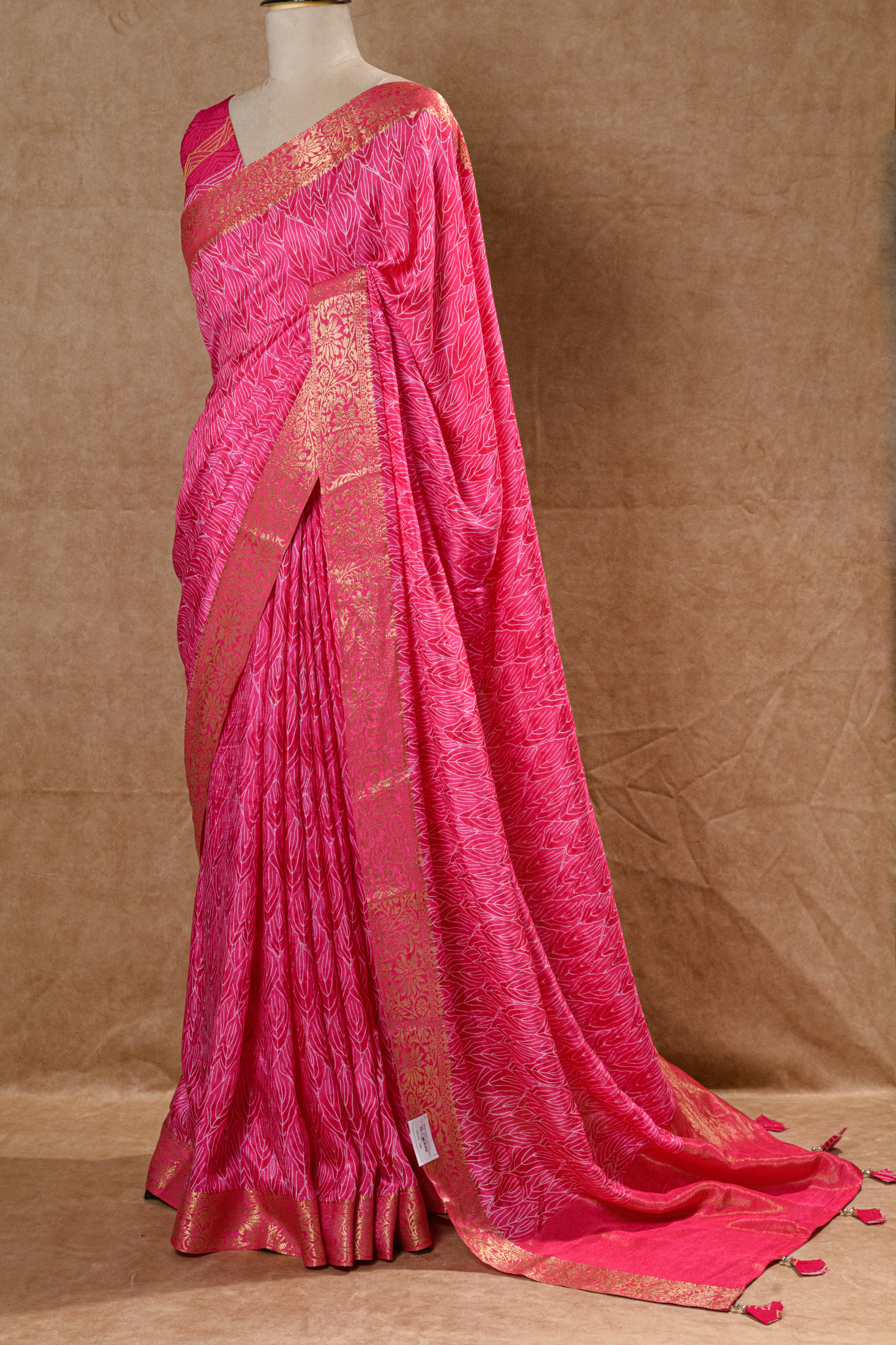 Rani Pink Crepe Silk Saree with Golden Zari Border and Embroidered Blouse