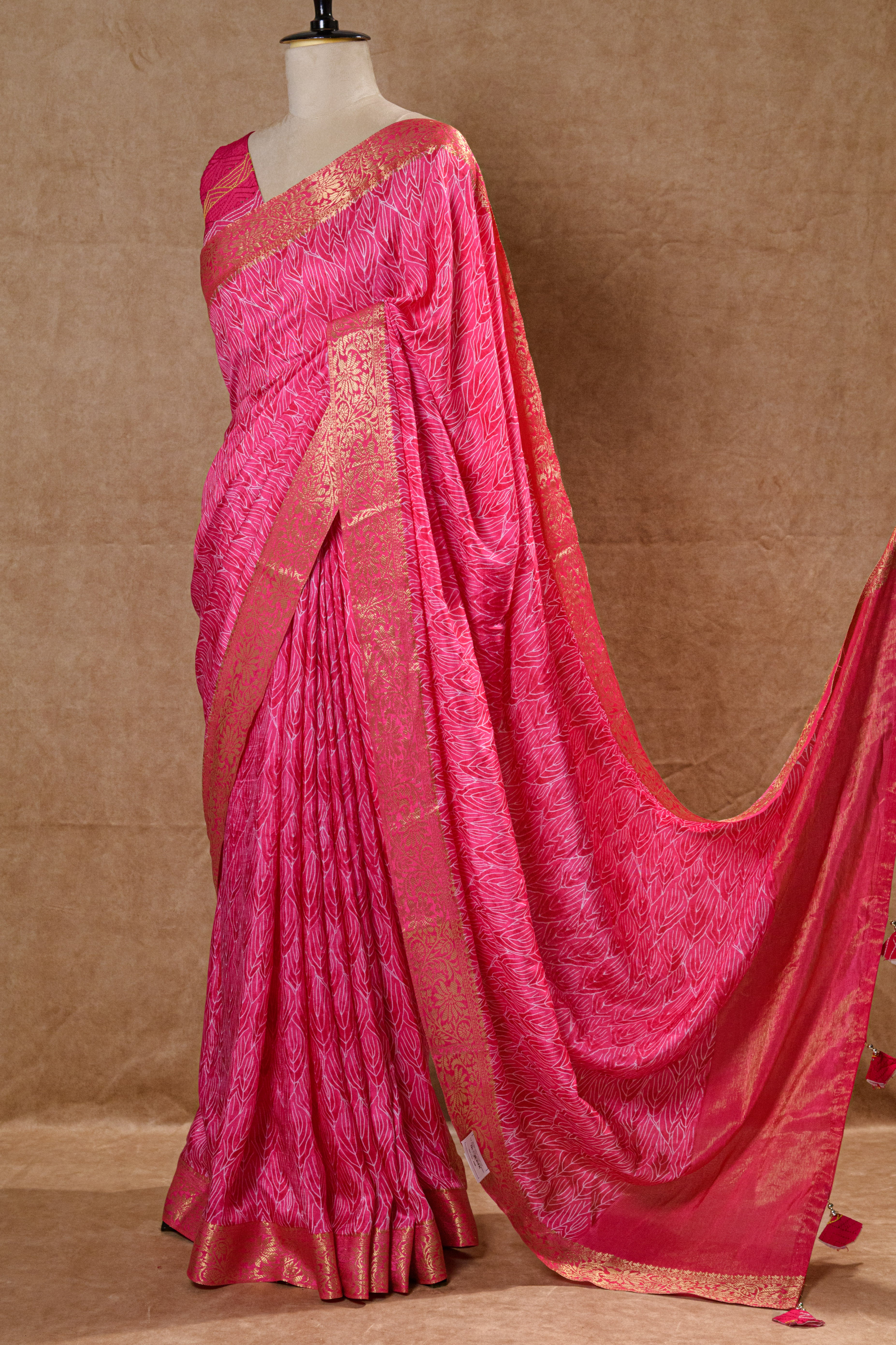 Rani Pink Crepe Silk Saree with Golden Zari Border and Embroidered Blouse